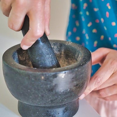 Mortar and Pestle grinding coffee